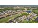 An aerial view shows a lovely community alongside a golf course and scenic ponds at 10517 Palm Cove Ave, Tampa, FL 33647