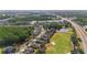 This is an aerial view of a neighborhood near a golf course, a highway, and scenic ponds at 10517 Palm Cove Ave, Tampa, FL 33647