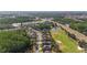 Here's an aerial of a neighborhood next to a golf course, lake, and tree lined highway at 10517 Palm Cove Ave, Tampa, FL 33647