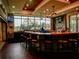Beautifully lit bar area with comfortable seating and scenic outdoor views at 10517 Palm Cove Ave, Tampa, FL 33647