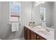 Well-lit bathroom with dual sinks, a large mirror, and plenty of counter space at 10517 Palm Cove Ave, Tampa, FL 33647