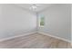 An empty bedroom with a ceiling fan and a window with blinds at 10517 Palm Cove Ave, Tampa, FL 33647