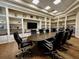 Well-furnished conference room with built-in shelving and a large meeting table at 10517 Palm Cove Ave, Tampa, FL 33647