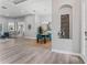 Bright dining room boasts sleek gray flooring, modern light fixture and gray walls at 10517 Palm Cove Ave, Tampa, FL 33647