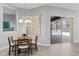 Dining room with dining table and chairs, and access to an outdoor covered patio at 10517 Palm Cove Ave, Tampa, FL 33647