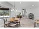 Bright open-concept living space with dining area, ceiling fan, and natural light at 10517 Palm Cove Ave, Tampa, FL 33647