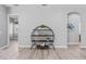 Living room with shelving unit for display and a view to other rooms at 10517 Palm Cove Ave, Tampa, FL 33647