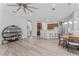 Open concept living space connects the dining area and kitchen, with modern decor at 10517 Palm Cove Ave, Tampa, FL 33647