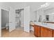 Bathroom with a vanity and sink, leading to other areas of the home at 10517 Palm Cove Ave, Tampa, FL 33647
