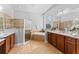 Main bathroom features a soaking tub, dual vanities, and a separate shower at 10517 Palm Cove Ave, Tampa, FL 33647