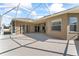 Spacious screened lanai offers a perfect outdoor living space with neutral tile flooring and plenty of natural light at 10517 Palm Cove Ave, Tampa, FL 33647
