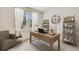 Bright home office with wooden desk and shelves, perfect for remote work or study at 10657 Bridgegate Heights Loop, San Antonio, FL 33576