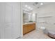 Bathroom features a vanity with ample storage and a toilet at 1170 Gulf Blvd # 2101, Clearwater Beach, FL 33767