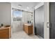 Well-lit bathroom offers a double sink vanity and an open shower at 1170 Gulf Blvd # 2101, Clearwater Beach, FL 33767