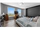 Bedroom with large windows, wood floors, and lake views at 1170 Gulf Blvd # 2101, Clearwater Beach, FL 33767