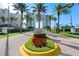 Beautifully landscaped entrance with lush greenery and a welcoming sign, creating an impressive arrival at 1170 Gulf Blvd # 2101, Clearwater Beach, FL 33767