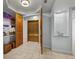 Elegant hallway with tile floors, a decorative light fixture, and elevator access at 1170 Gulf Blvd # 2101, Clearwater Beach, FL 33767