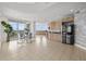 Modern living space with dining area, sleek kitchen, and stunning ocean views at 1170 Gulf Blvd # 2101, Clearwater Beach, FL 33767