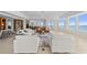 Bright living room with stylish furniture, tile floors, and breathtaking views of the ocean at 1170 Gulf Blvd # 2101, Clearwater Beach, FL 33767