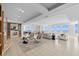 Expansive living room with tile floors, a fireplace, and beautiful ocean views from numerous windows at 1170 Gulf Blvd # 2101, Clearwater Beach, FL 33767
