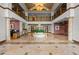 Stunning two-story lobby with a water fountain, marble floors, and elegant architecture at 1170 Gulf Blvd # 2101, Clearwater Beach, FL 33767