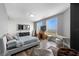 Bright main bedroom with water views, a desk, hardwood floors, and sleek contemporary decor at 1170 Gulf Blvd # 2101, Clearwater Beach, FL 33767