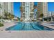 Gorgeous community pool with lap lanes and lounge chairs with a clear view of the surrounding condominium buildings at 1170 Gulf Blvd # 2101, Clearwater Beach, FL 33767