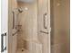 Modern tiled shower with built-in bench and grab bars for safety and convenience at 1170 Gulf Blvd # 2101, Clearwater Beach, FL 33767