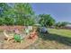 Spacious backyard featuring a fire pit seating area and an above-ground pool, perfect for outdoor gatherings at 12923 Colony Rd, Hudson, FL 34669