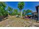 Expansive backyard featuring ample space for recreation, a pool, and outdoor seating, perfect for gatherings at 12923 Colony Rd, Hudson, FL 34669