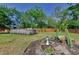 Landscaped backyard featuring an above-ground pool and a beautiful garden, ideal for outdoor enjoyment at 12923 Colony Rd, Hudson, FL 34669