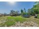 Spacious backyard with a refreshing above-ground pool and lush green surroundings for outdoor enjoyment at 12923 Colony Rd, Hudson, FL 34669