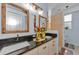 Bathroom with granite countertops, double sinks, and private access to a full shower at 12923 Colony Rd, Hudson, FL 34669