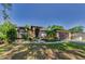 Beautiful home with a well maintained yard, front garden and inviting entry way at 12923 Colony Rd, Hudson, FL 34669