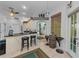 Open-concept kitchen featuring a breakfast bar, decor, and tiled flooring at 12923 Colony Rd, Hudson, FL 34669