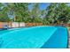 Inviting above-ground pool with clear blue water, ready for swimming and relaxation on sunny days at 12923 Colony Rd, Hudson, FL 34669
