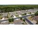 An aerial view shows the neighborhood's layout, highlighting the property's location within a friendly community at 13637 Blythewood Dr, Spring Hill, FL 34609