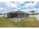 A spacious, well-maintained yard with a screened-in pool and spa, perfect for outdoor activities and relaxation at 13637 Blythewood Dr, Spring Hill, FL 34609