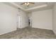 The bedroom features tile flooring, tray ceilings, and is connected to the bathroom at 13637 Blythewood Dr, Spring Hill, FL 34609