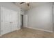 Bedroom featuring carpet, ceiling fan, and closet at 13637 Blythewood Dr, Spring Hill, FL 34609