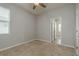 Bedroom features neutral carpet, a window providing natural light, and a closet at 13637 Blythewood Dr, Spring Hill, FL 34609