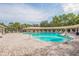 Expansive community pool area with lounging spots, perfect for enjoying sunny days and socializing with neighbors at 13637 Blythewood Dr, Spring Hill, FL 34609