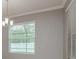 Dining area with natural light and classic crown molding at 13637 Blythewood Dr, Spring Hill, FL 34609