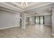 Open-concept living room with tile flooring, recessed lighting, adjacent to a view of the pool at 13637 Blythewood Dr, Spring Hill, FL 34609