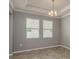 Well-lit living room showcasing tile floors and recessed lighting, complemented by gray paint at 13637 Blythewood Dr, Spring Hill, FL 34609