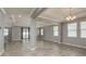 Open-concept living room featuring tile flooring, recessed lighting, and neutral gray wall paint at 13637 Blythewood Dr, Spring Hill, FL 34609