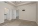 This main bedroom is carpeted and offers an ensuite bathroom at 13637 Blythewood Dr, Spring Hill, FL 34609