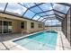 Inviting screened pool area with a spa and brick paver deck, perfect for relaxation and entertainment at 13637 Blythewood Dr, Spring Hill, FL 34609