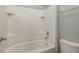 A modern walk-in shower stall, with white tiling and updated fixtures at 13637 Blythewood Dr, Spring Hill, FL 34609