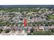 Aerial view of a neighborhood surrounded by lush green spaces and golf courses at 1416 Buckner Rd, Valrico, FL 33596